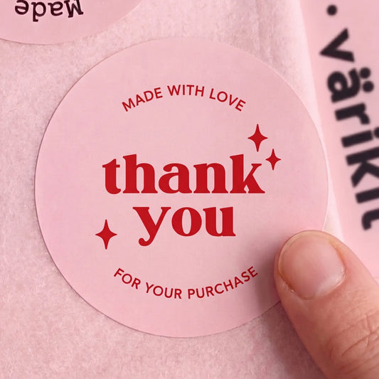 Matte 2-inch paper seal used to mark boutique packaging with a distinct studio identity.