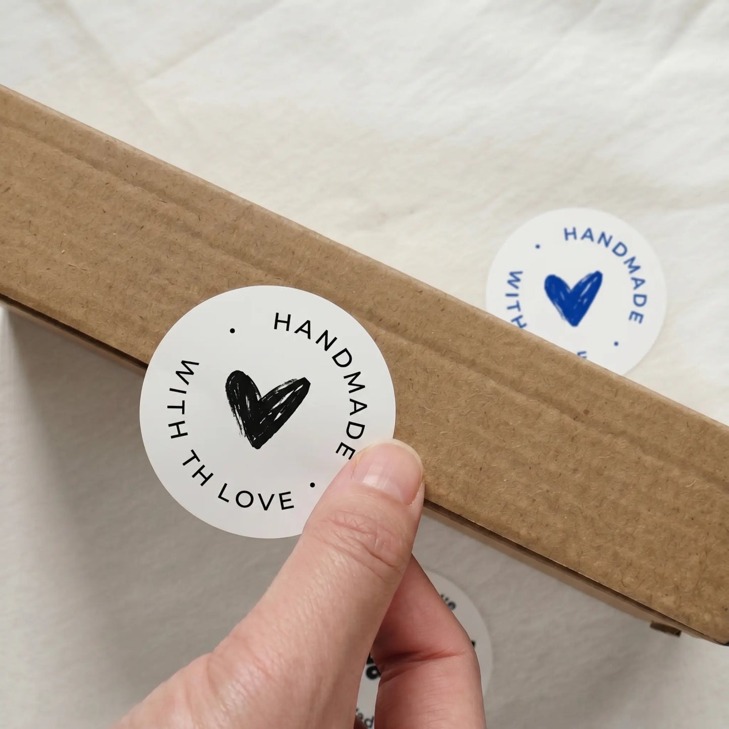 Handmade with love sticker on a cardboard box