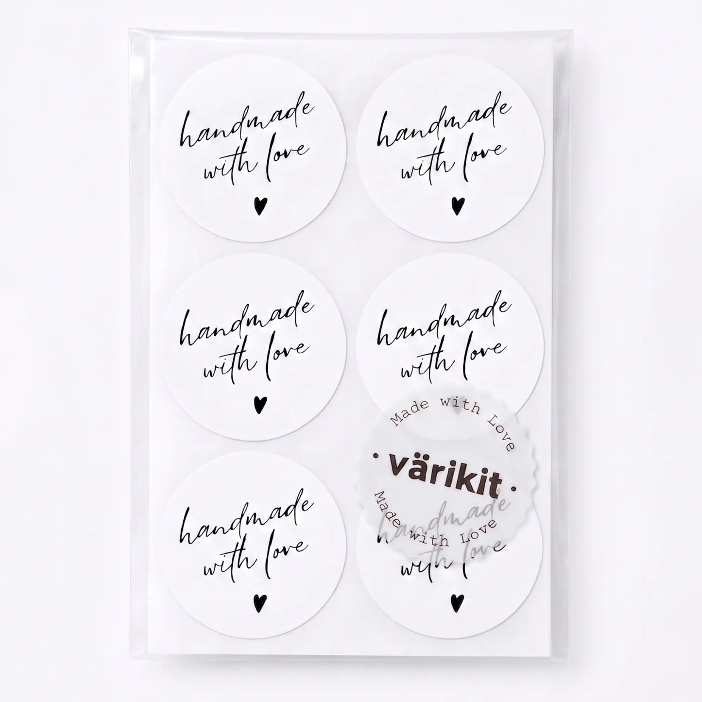 Handmade with love sticker with handwritten type script design in white and black