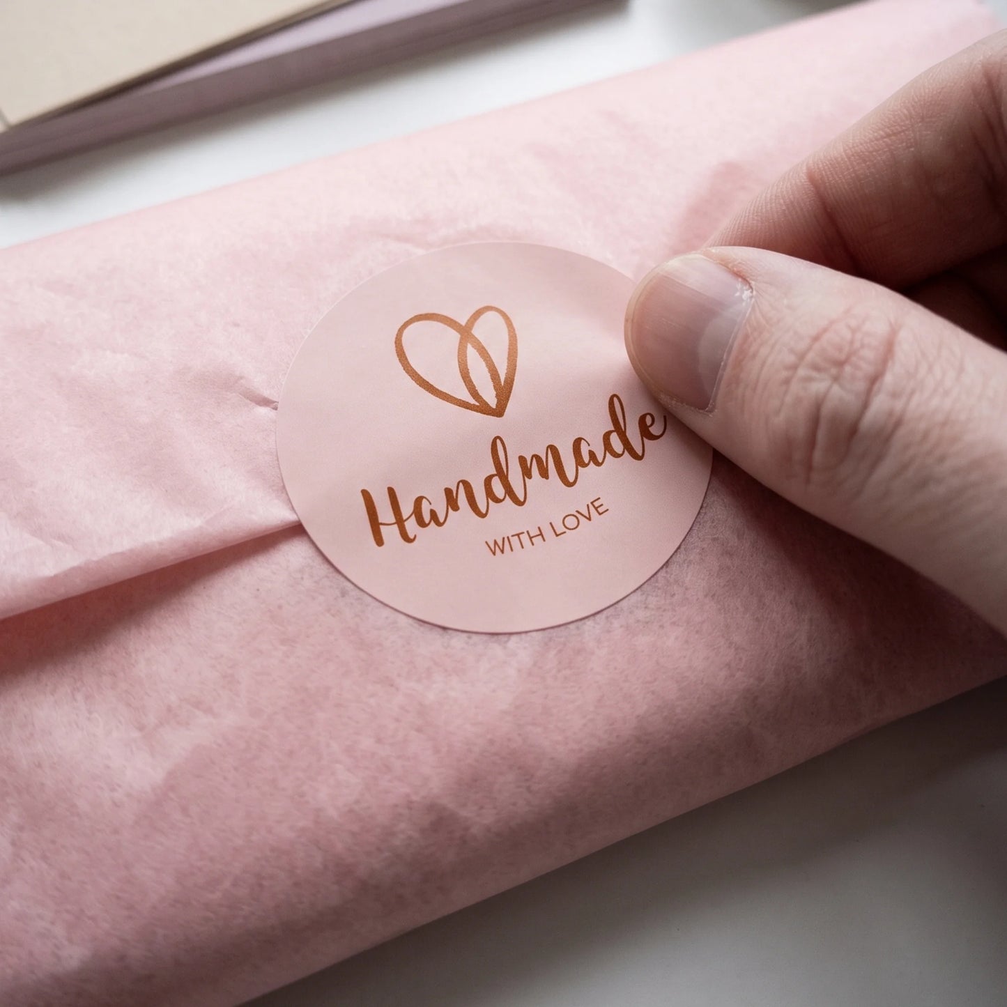 Layer a cursive line heart label over retail boxes for an artisan touch.