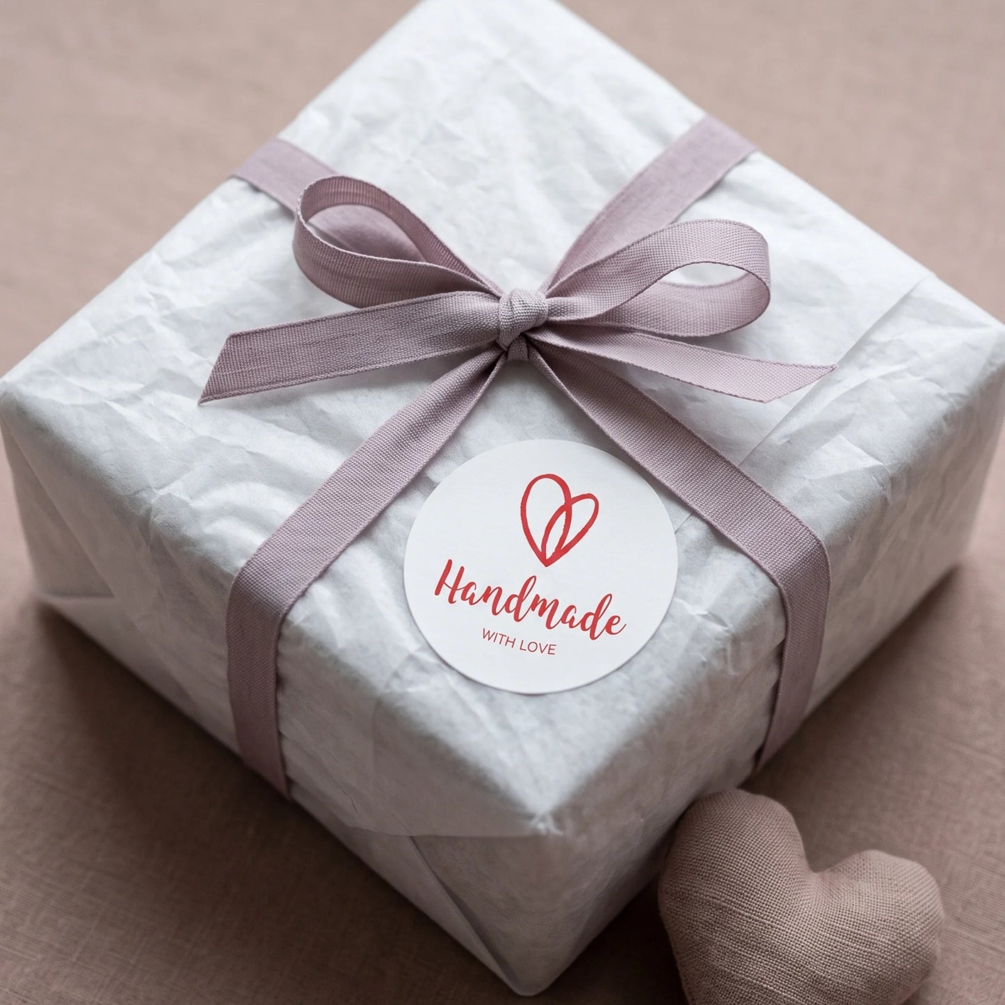 Seal outbound e-commerce mailers with an expressive script typography sticker.