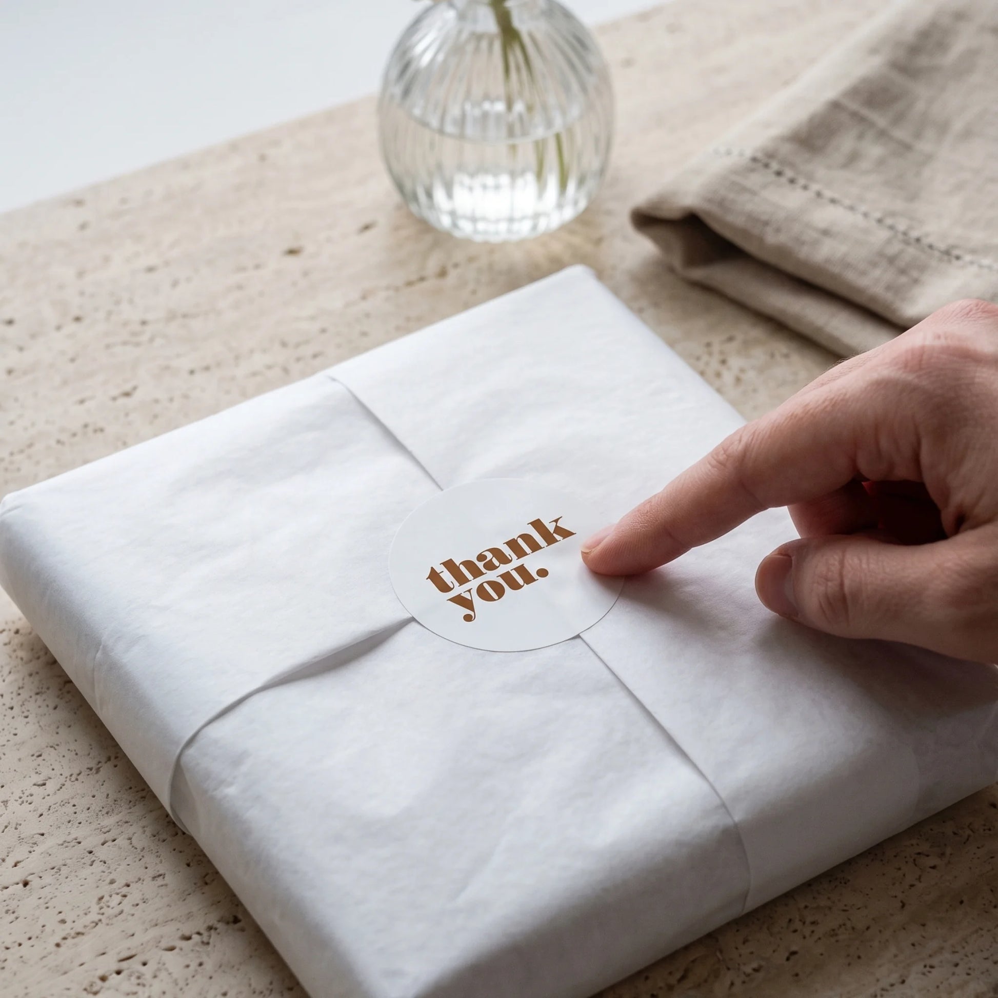 Seal small business shipments with a bold lowercase thank you sticker.