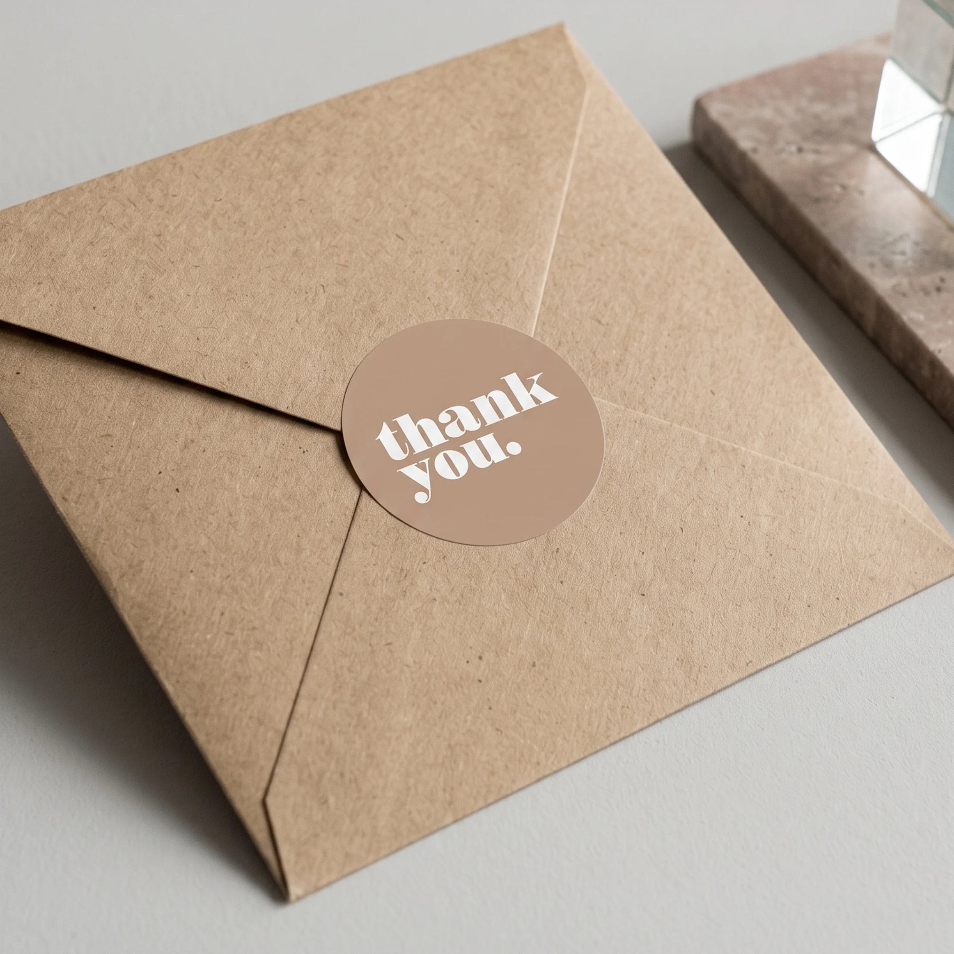 A 2-inch matte paper sticker designed for independent brands during order fulfillment.