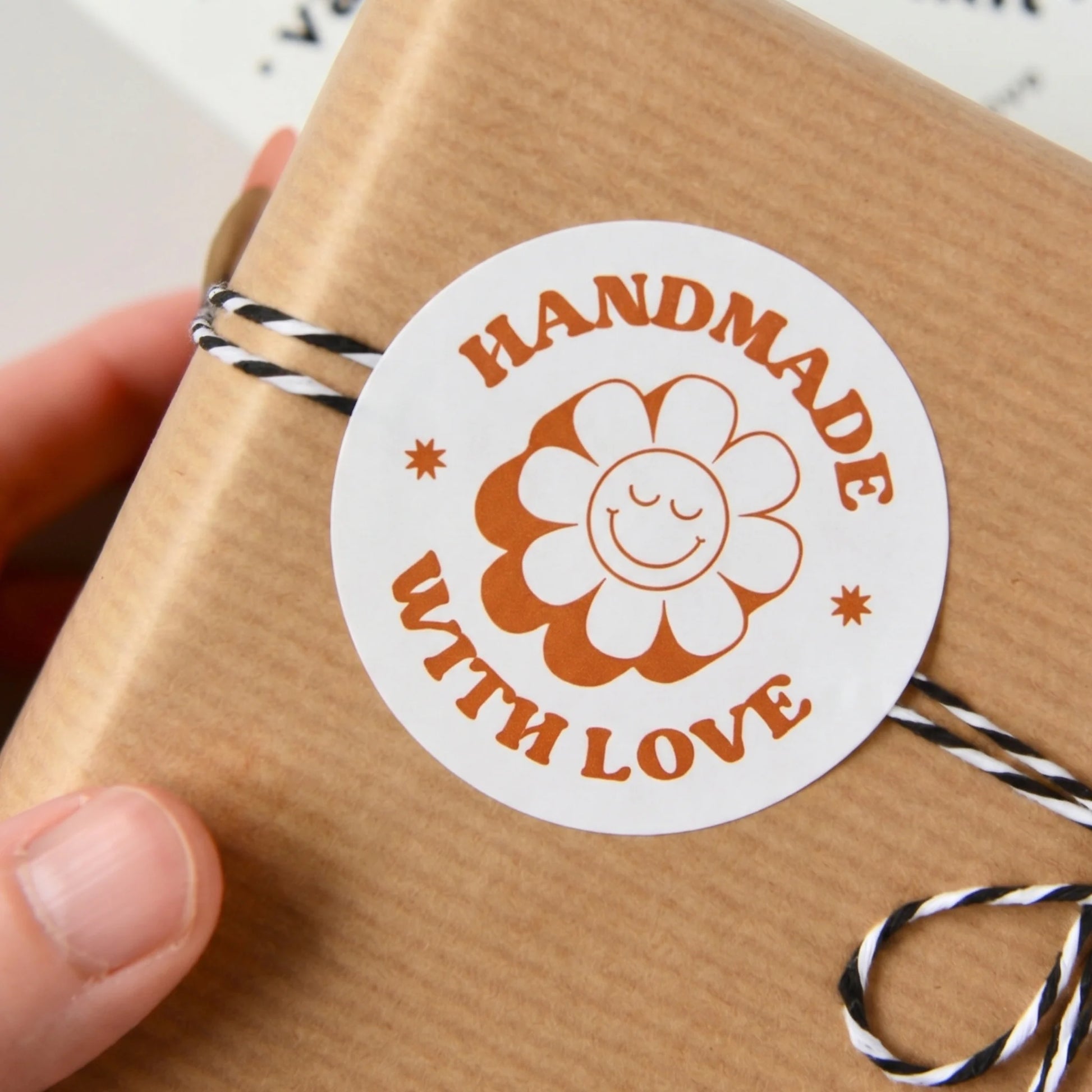 Brown paper gift packaging with 'Handmade with Love' label