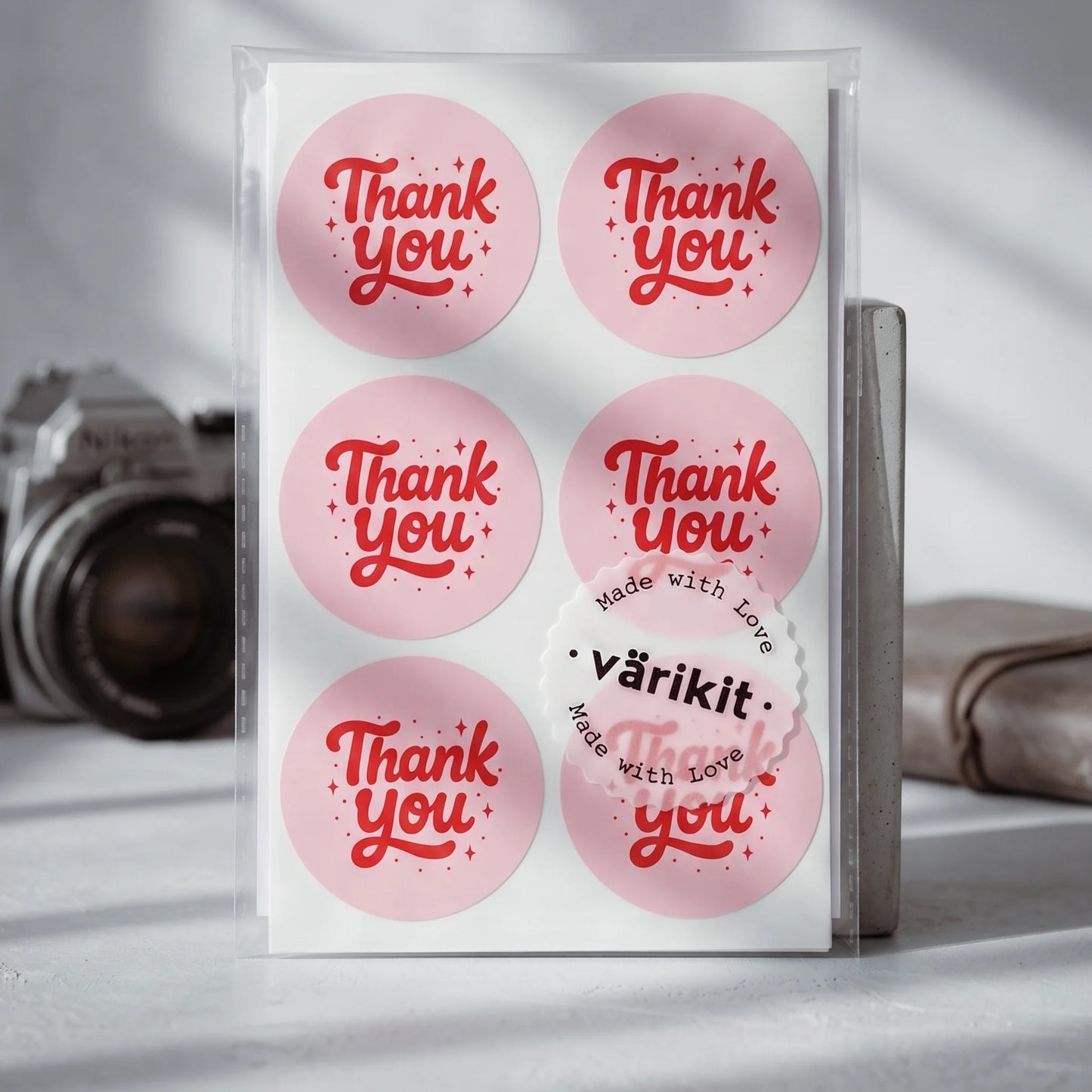 Elegant hand-lettered script securing product packaging with a charming touch.