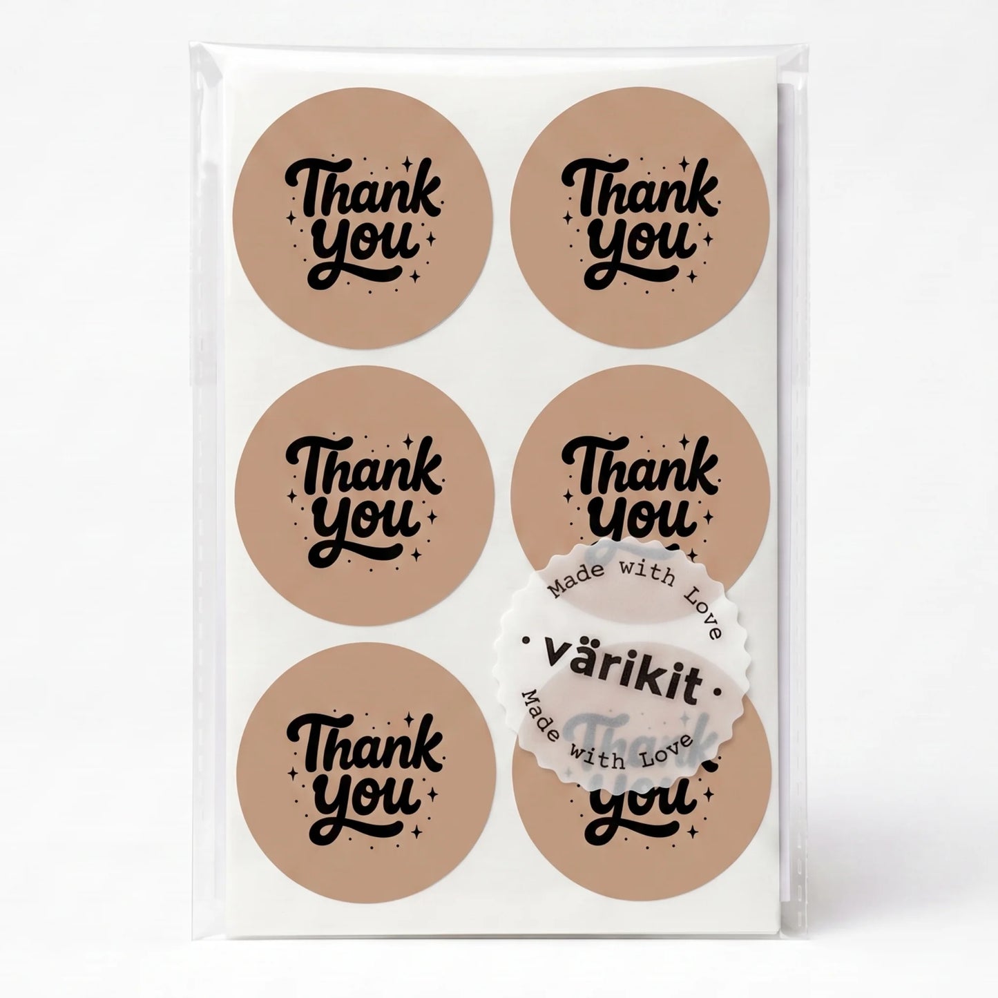 black ink on brown paper, 2-inch round retro typography, vintage spencerian thank you script.
