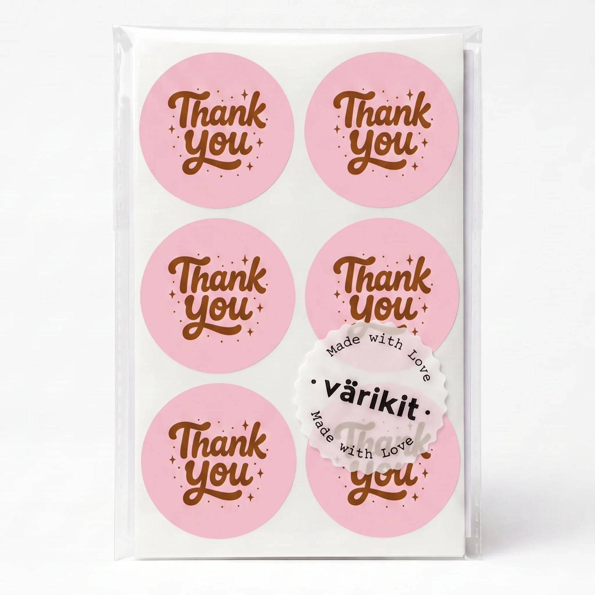 coffee ink on pink paper, 2-inch round retro typography, stars and dots accents.