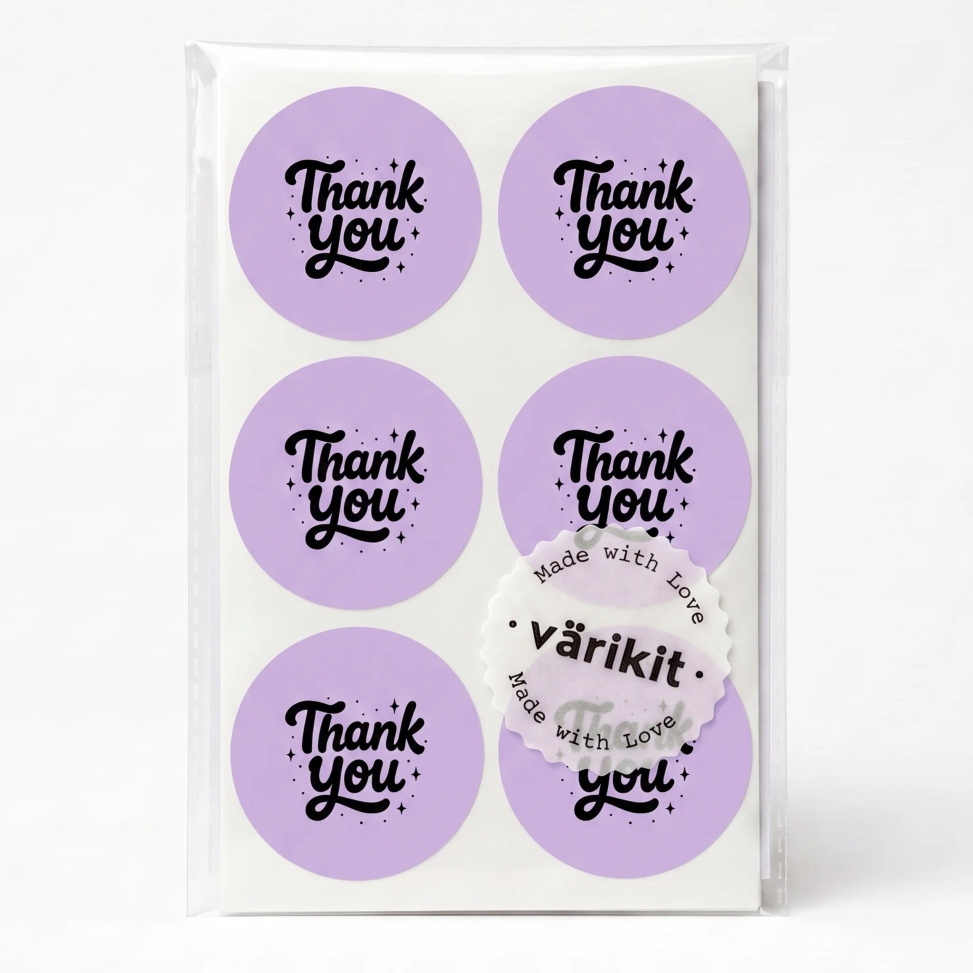 black ink on purple paper, 2-inch round vintage labels, vintage spencerian thank you script.