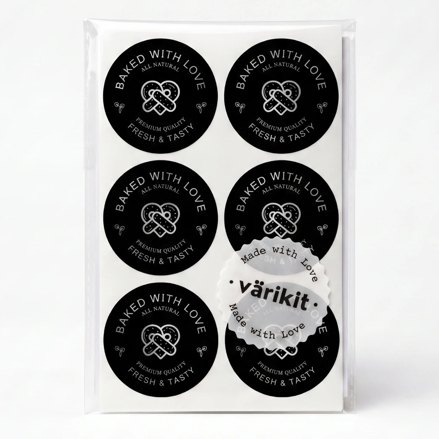 silver foil on black paper, 2-inch round bakery packaging, baked with love lettering.