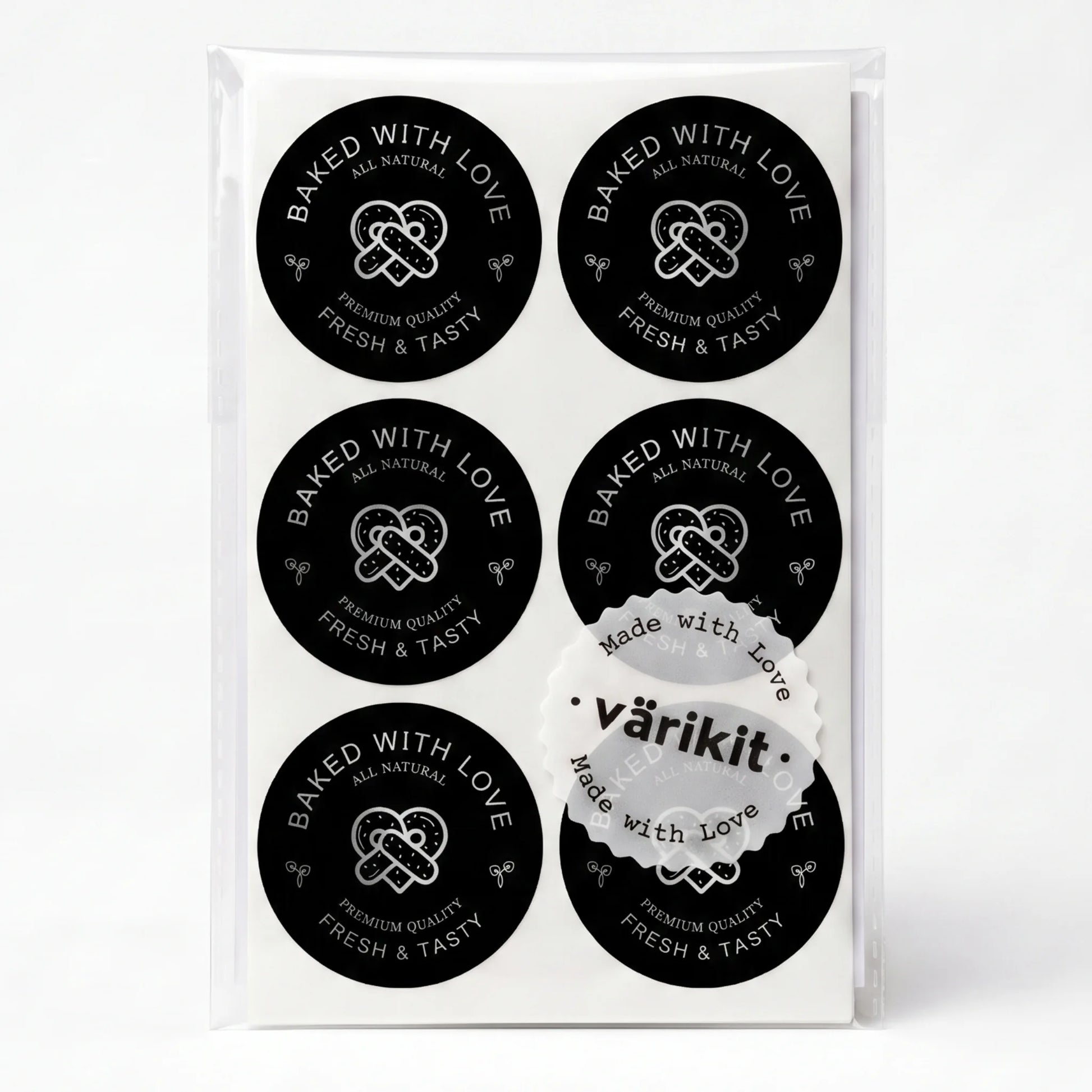 silver foil on black paper, 2-inch round bakery packaging, baked with love lettering.