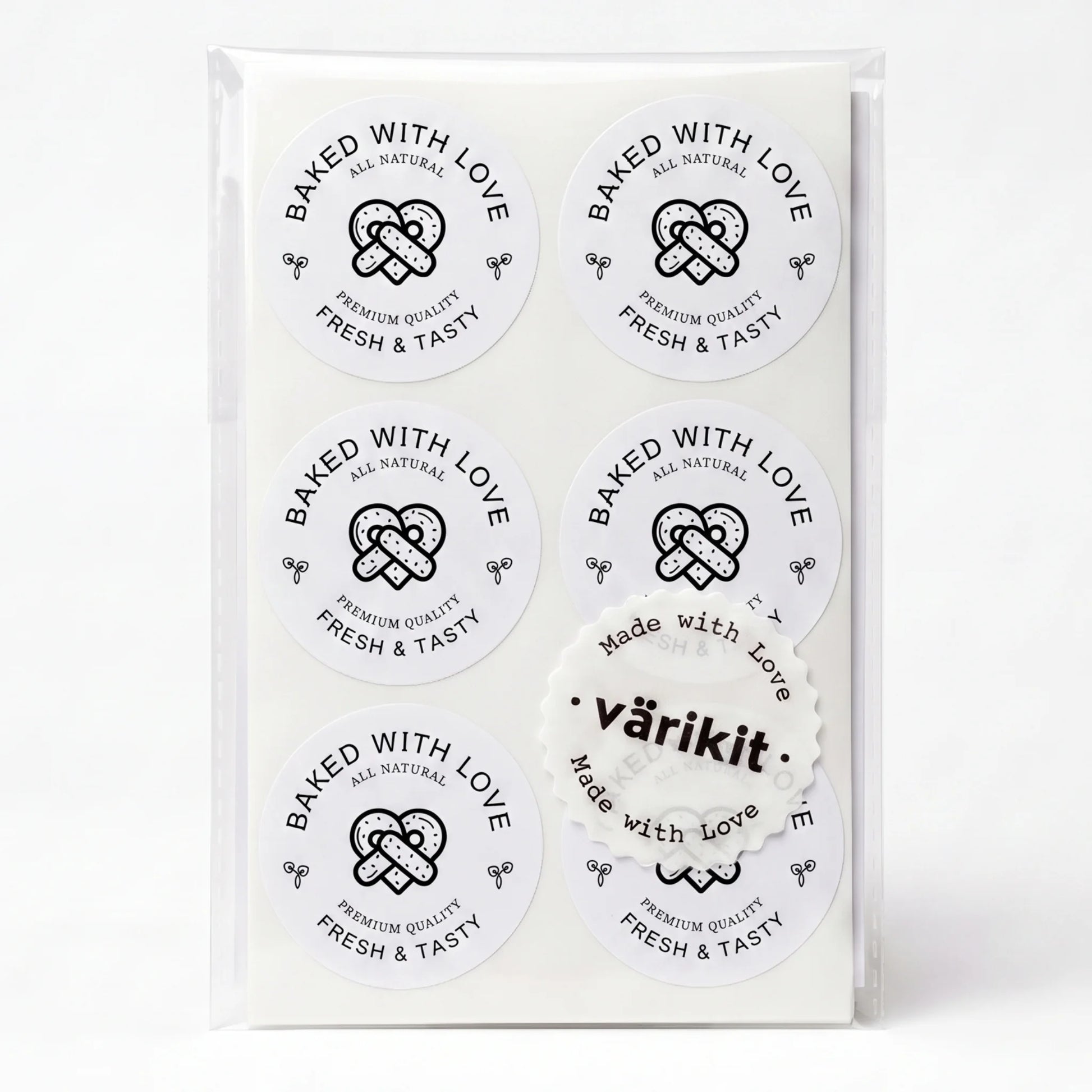 black ink on white paper, 2-inch round food packaging, baked with love lettering.