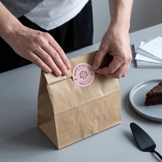 Clear protective sleeve holding multiple sheet of Baked With Love Modern Cake Monoline Varikit stickers reading 'Baked with Love'.