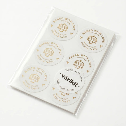 Pack of stickers with 'Baked with Love' gold foil text and 'varikit' branding on a white background
