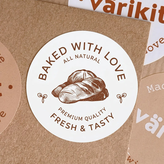 Round sticker with 'Baked with Love' text and bread illustration on a brown paper background