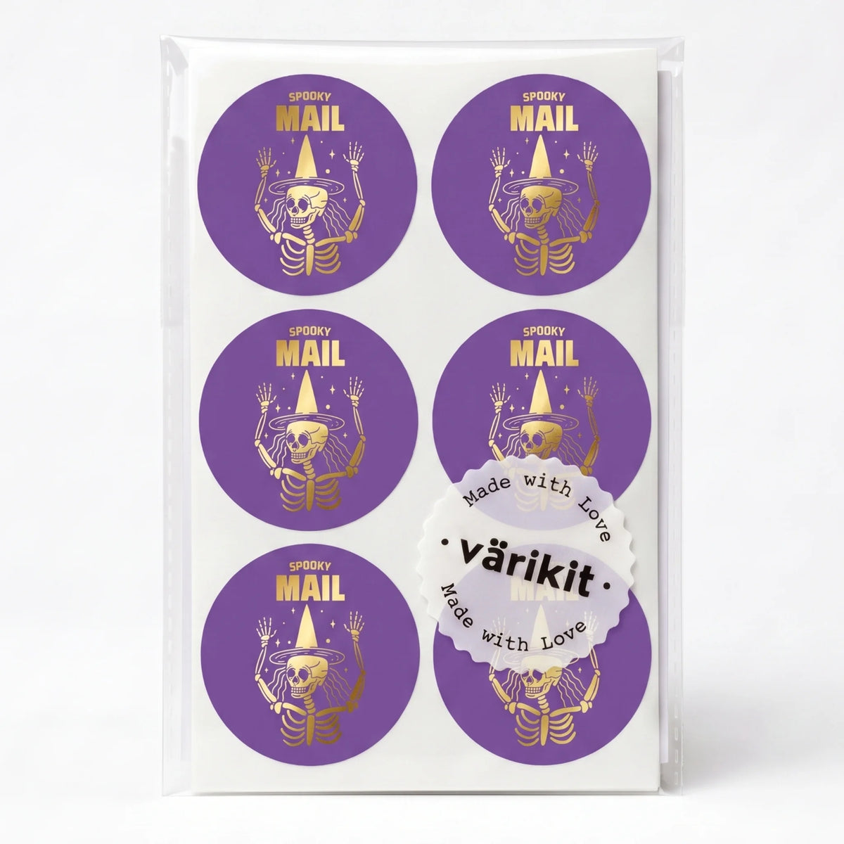 gold foil on dark purple paper, 2-inch round spooky packaging labels, witch hat skeleton waving.