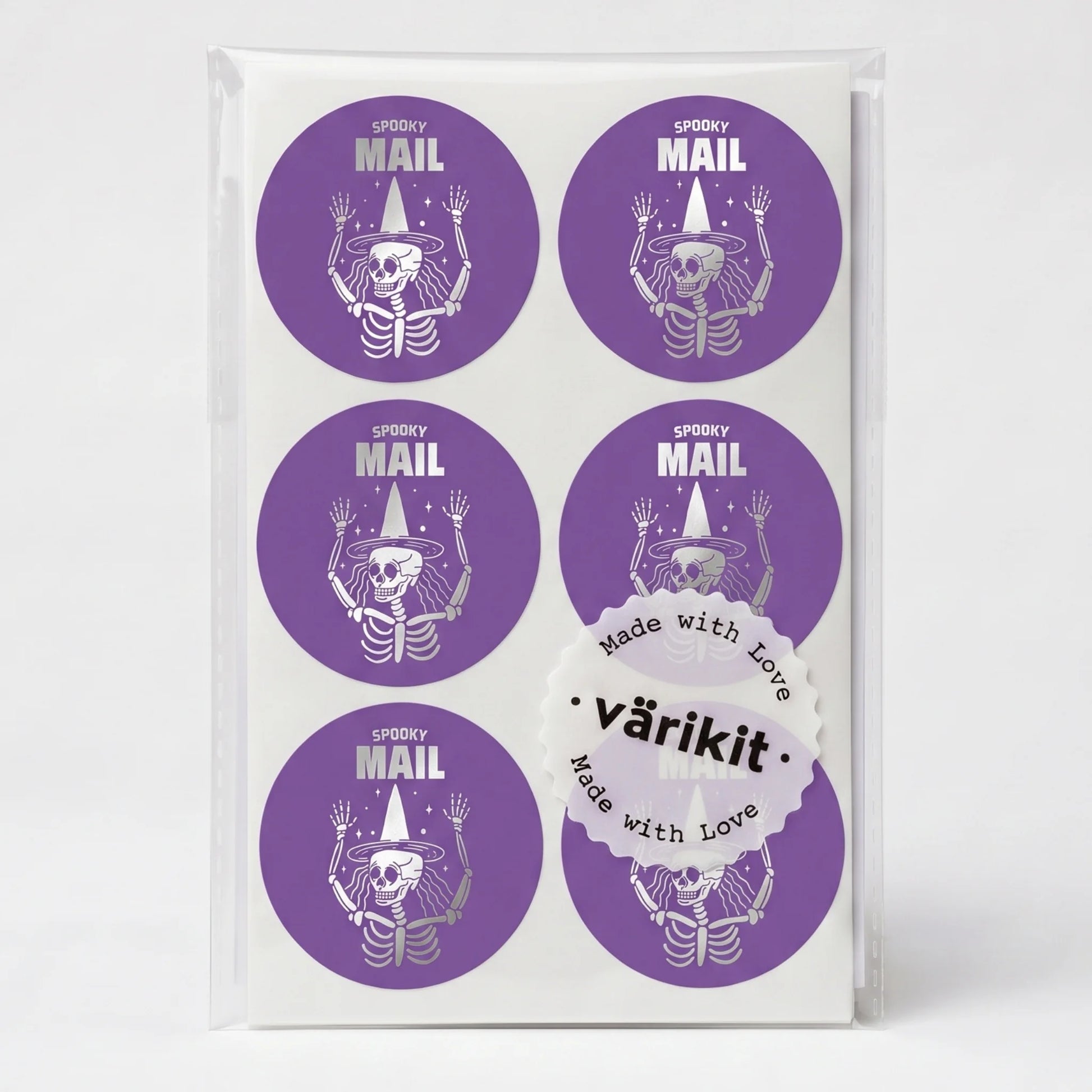 silver foil on dark purple paper, 2-inch round spooky packaging labels, spooky mail lettering.