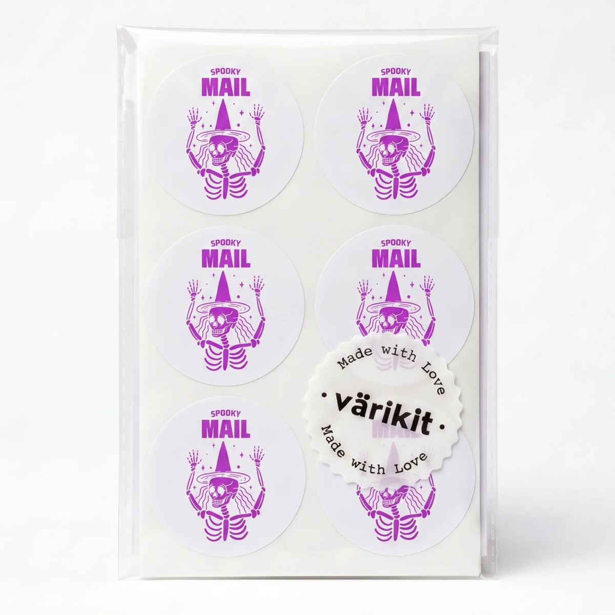purple ink on white paper, 2-inch round spooky mail labels, spooky mail lettering.