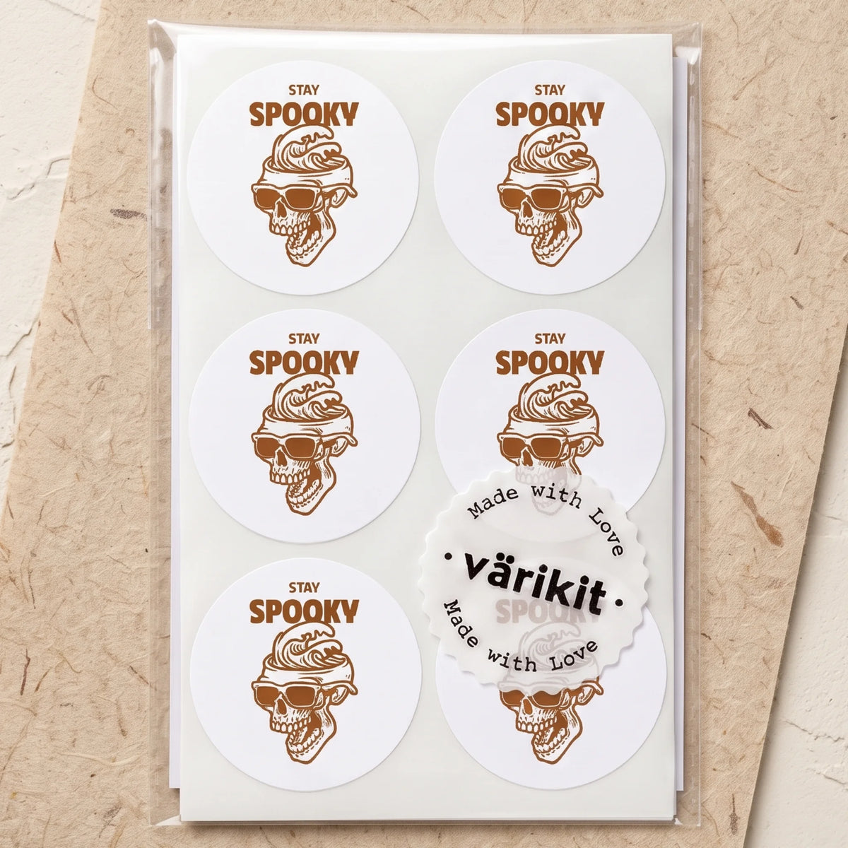 Round paper seal marking boutique orders with a distinct festive identity.