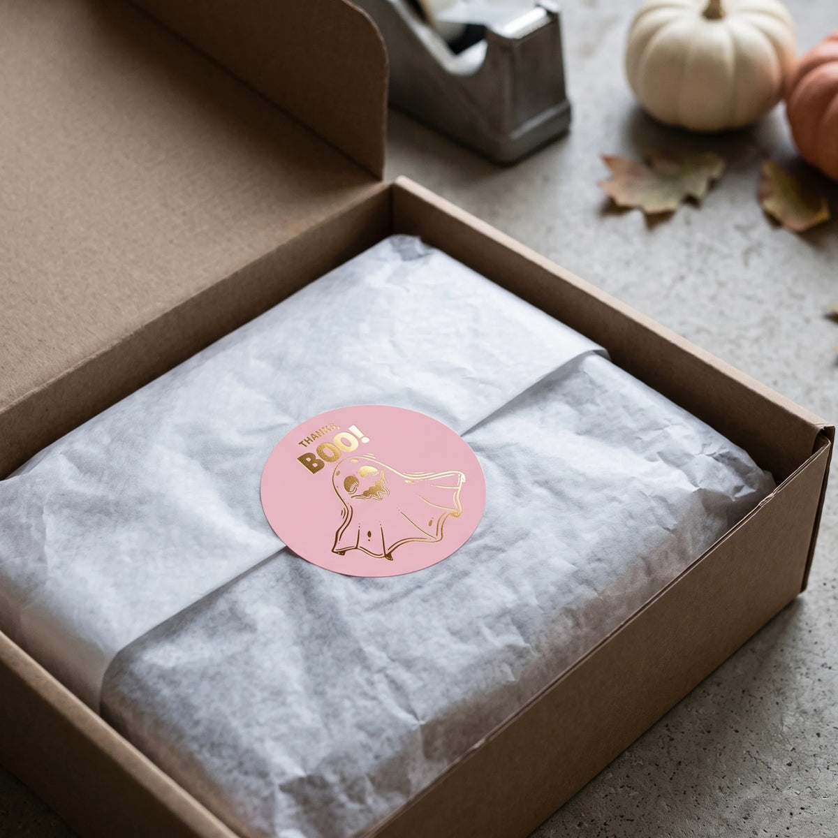 A friendly floating ghost finishing the unboxing experience with warm cheer.