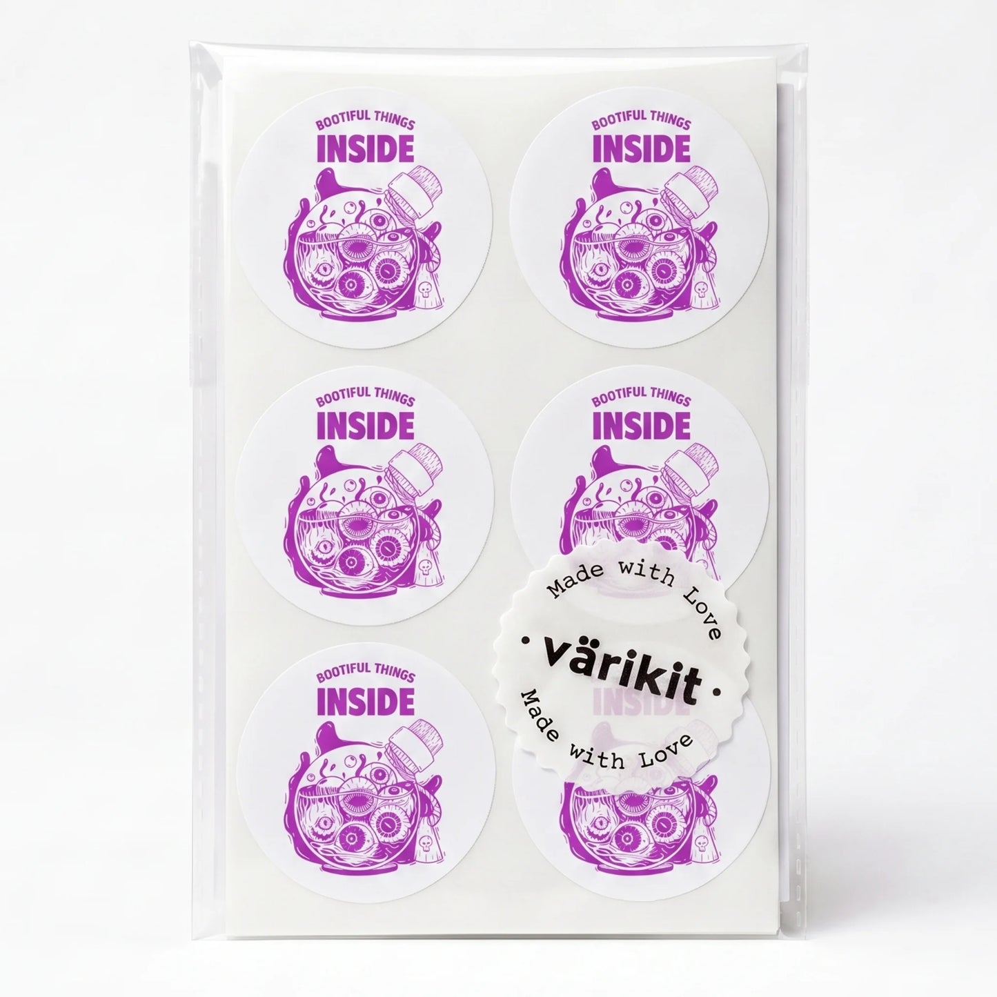purple ink on white paper, 2-inch round envelope seals, weird ironic design.