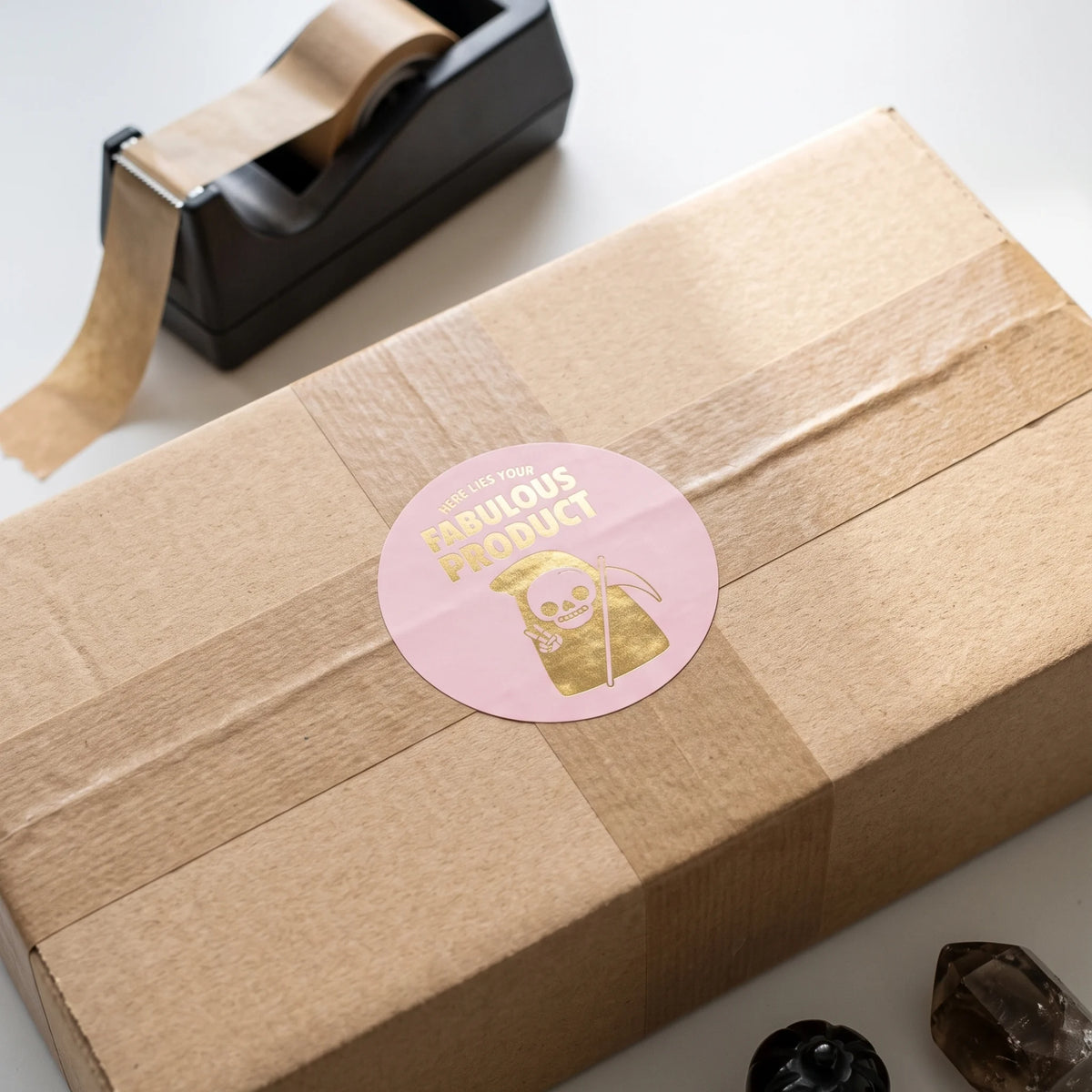 Round paper seal marking boutique orders with a distinct ironic identity.