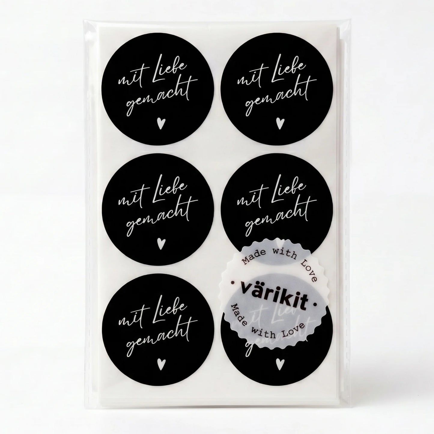 Set of black round stickers with white text 'mit Liebe gemacht' on a white background
