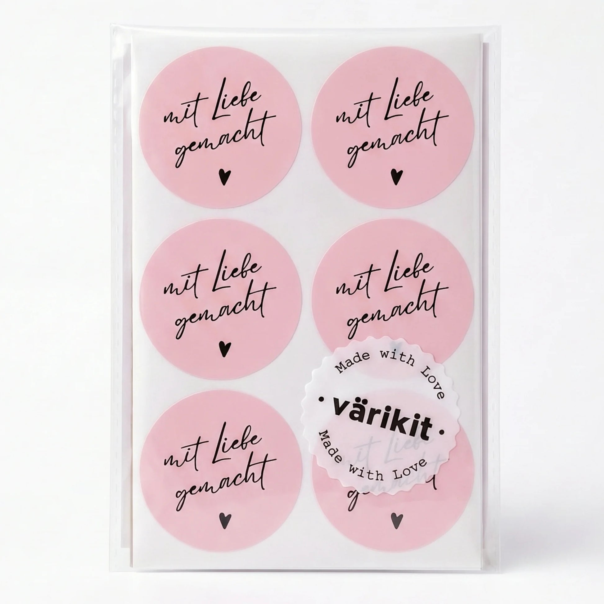 Set of pink stickers with 'mit Liebe gemacht' text on a white background