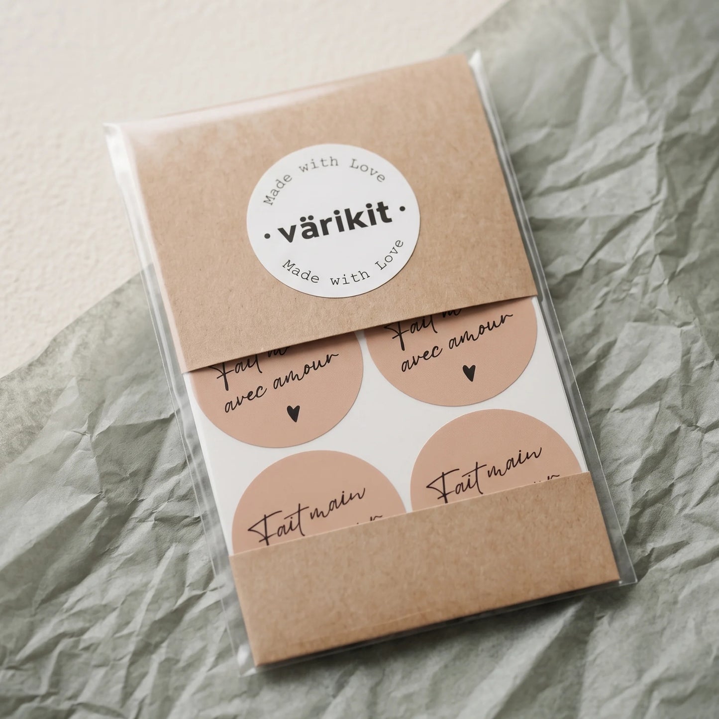 Finish handcrafted product packaging with a handwritten French heart seal.
