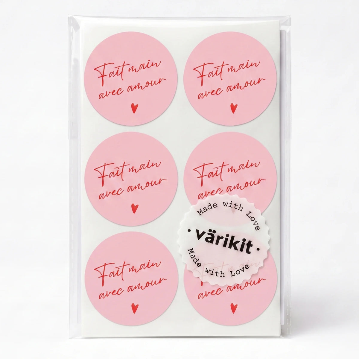 red ink on pink paper, 2-inch round vintage fonts, handwritten french script.