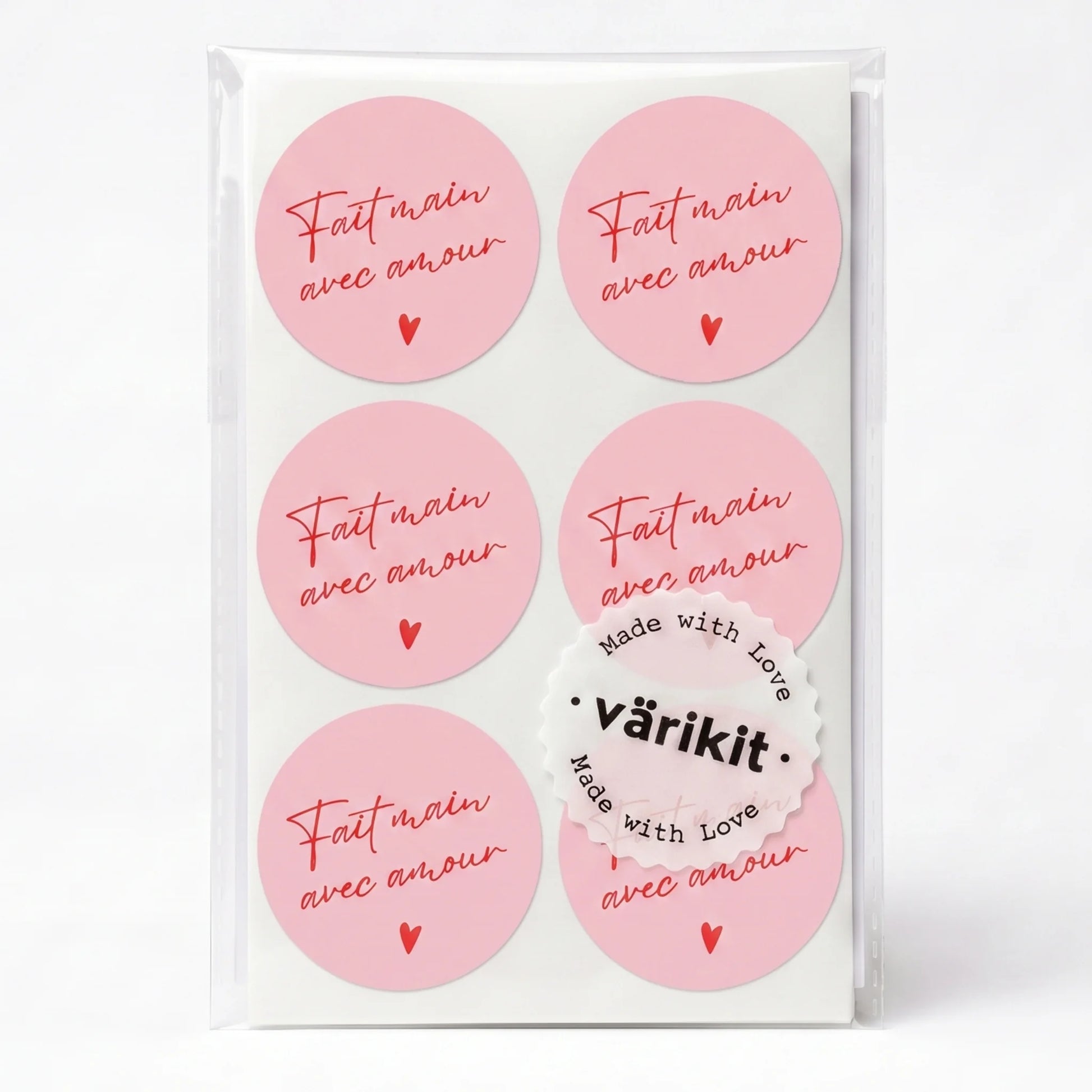 red ink on pink paper, 2-inch round vintage fonts, handwritten french script.