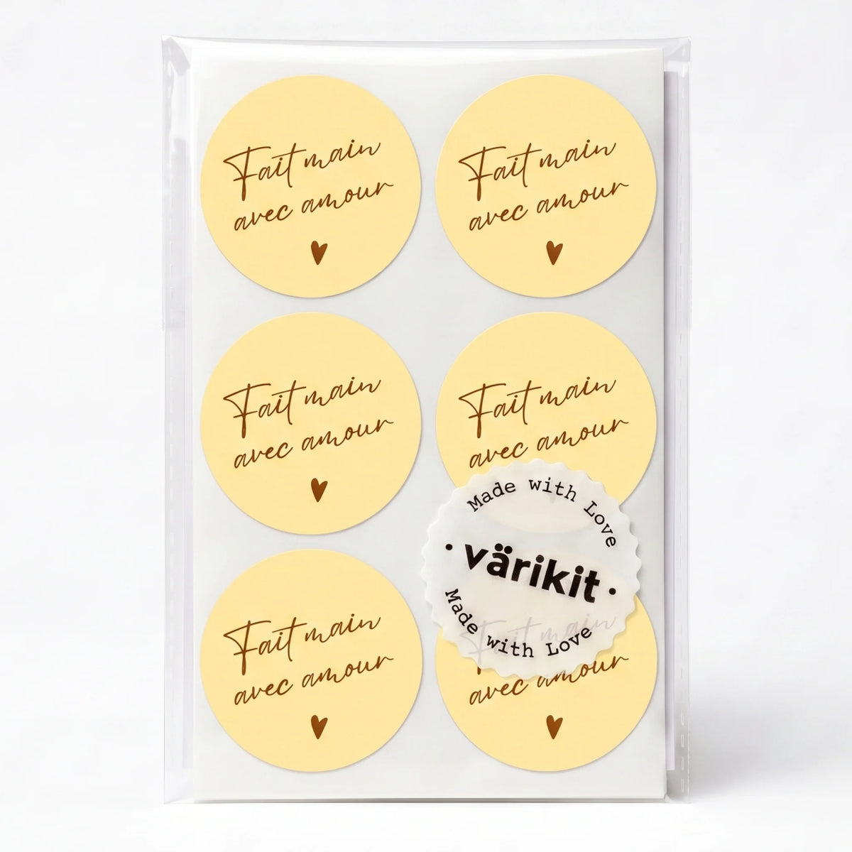 coffee ink on yellow paper, 2-inch round typography, handwritten french script.