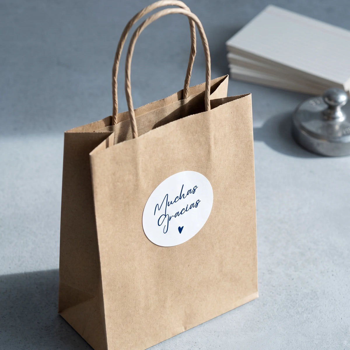 Seal outbound online orders with an expressive Spanish cursive typography label.