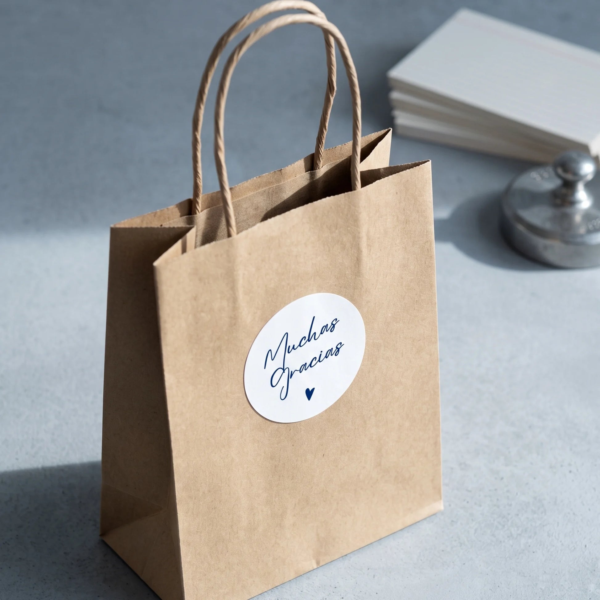 Seal outbound online orders with an expressive Spanish cursive typography label.