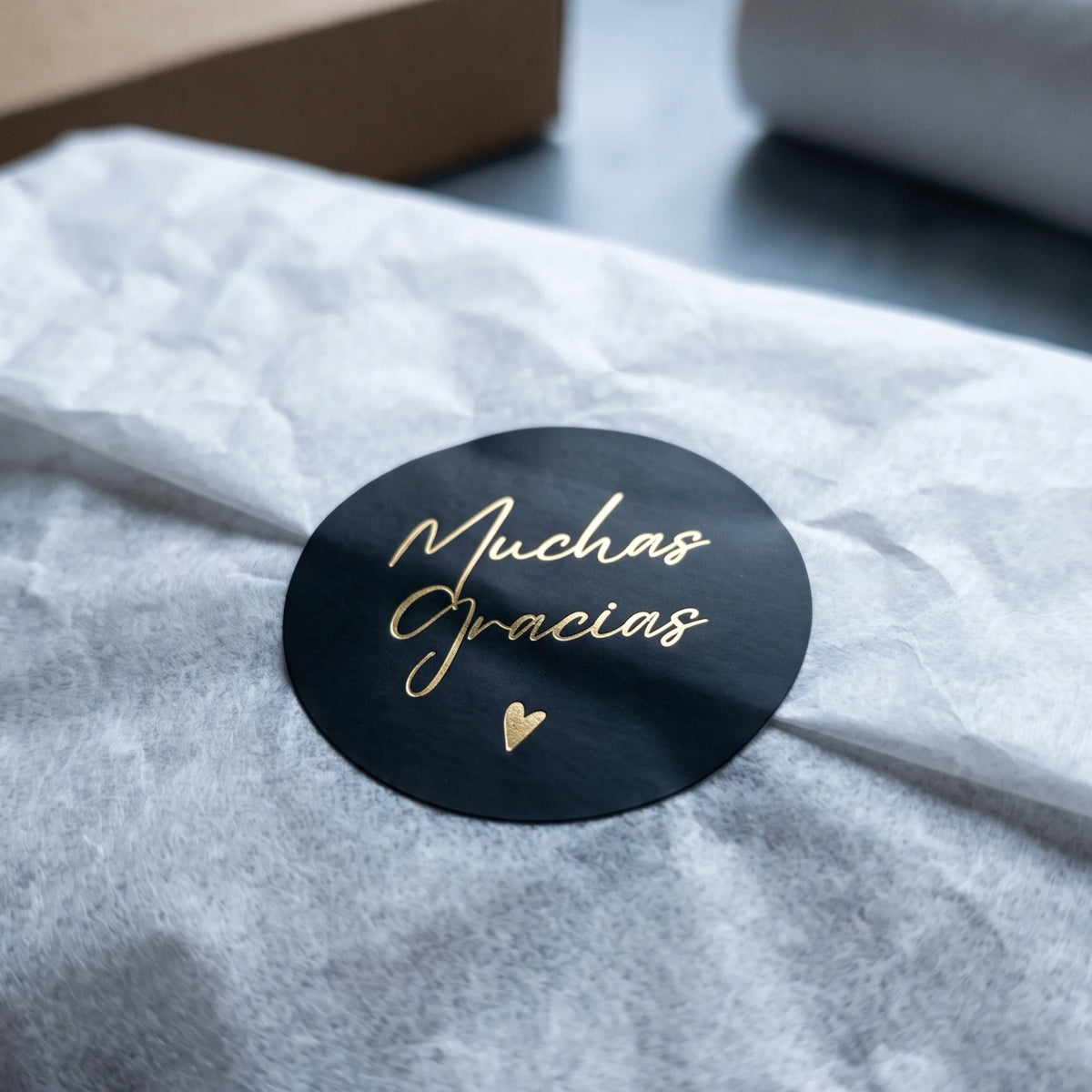 Finish handmade product boxes with a delicate Spanish cursive paper seal.