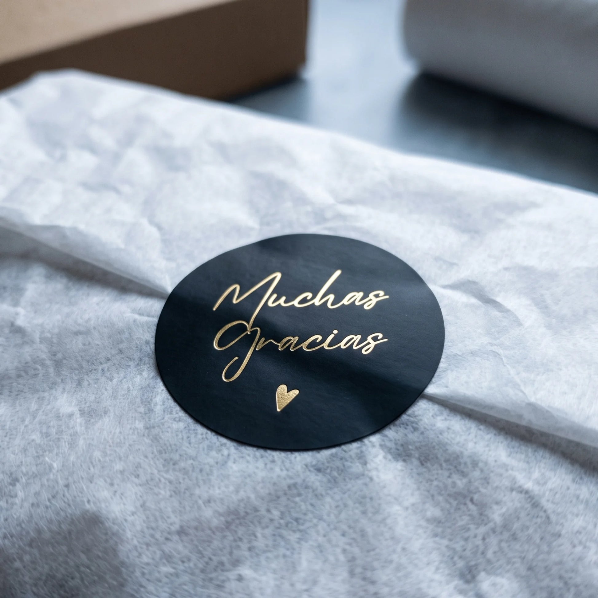 Finish handmade product boxes with a delicate Spanish cursive paper seal.